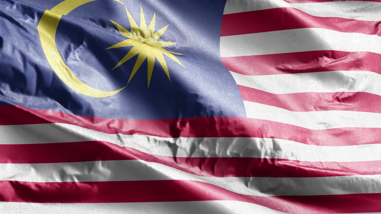 Bandiera tessile della Malesia che sventola al vento in loop. Stendardo malese che ondeggia nella brezza. Tessuto. Sfondo a riempimento completo. Loop di 10 secondi.