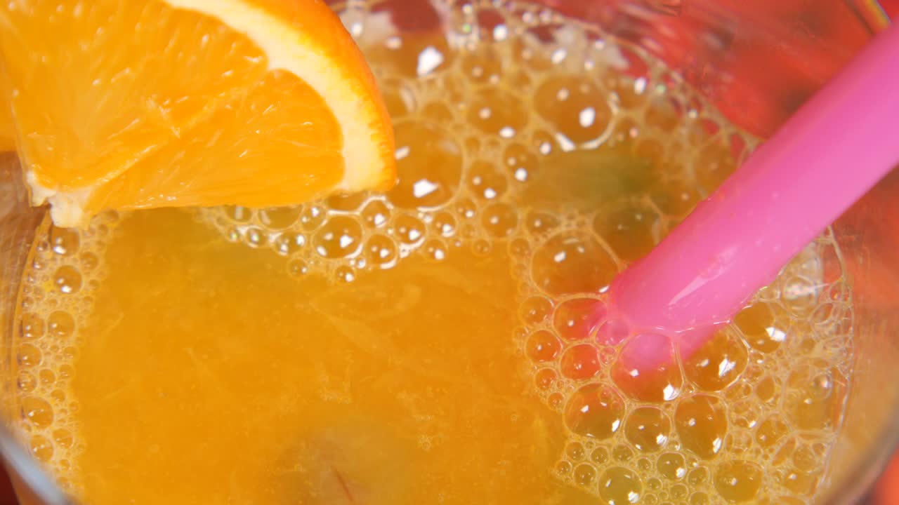 Orange Juice with Bubbles and Straw