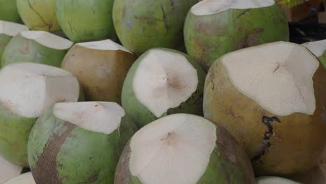 pile of fresh green coconuts