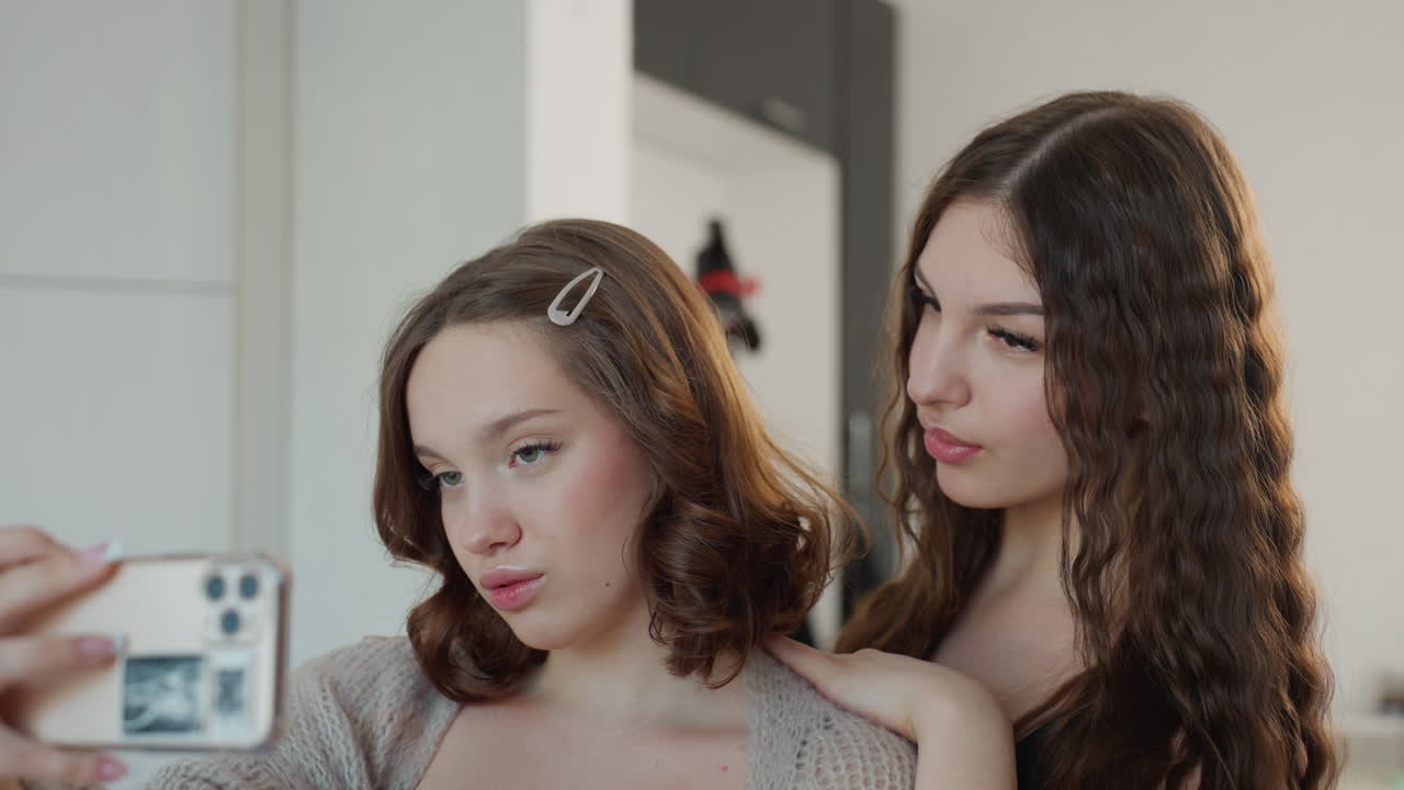 Friends Taking Selfies, Casual Group Capturing Mirror Images, Young Friends Displaying Playful Expressions With Phones, Group Of Youthful Individuals Creating Content Through Mirror Selfies