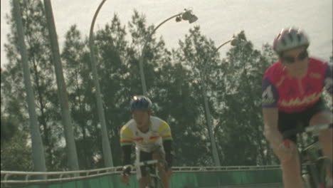 bicyclists compete on a circuit track 1