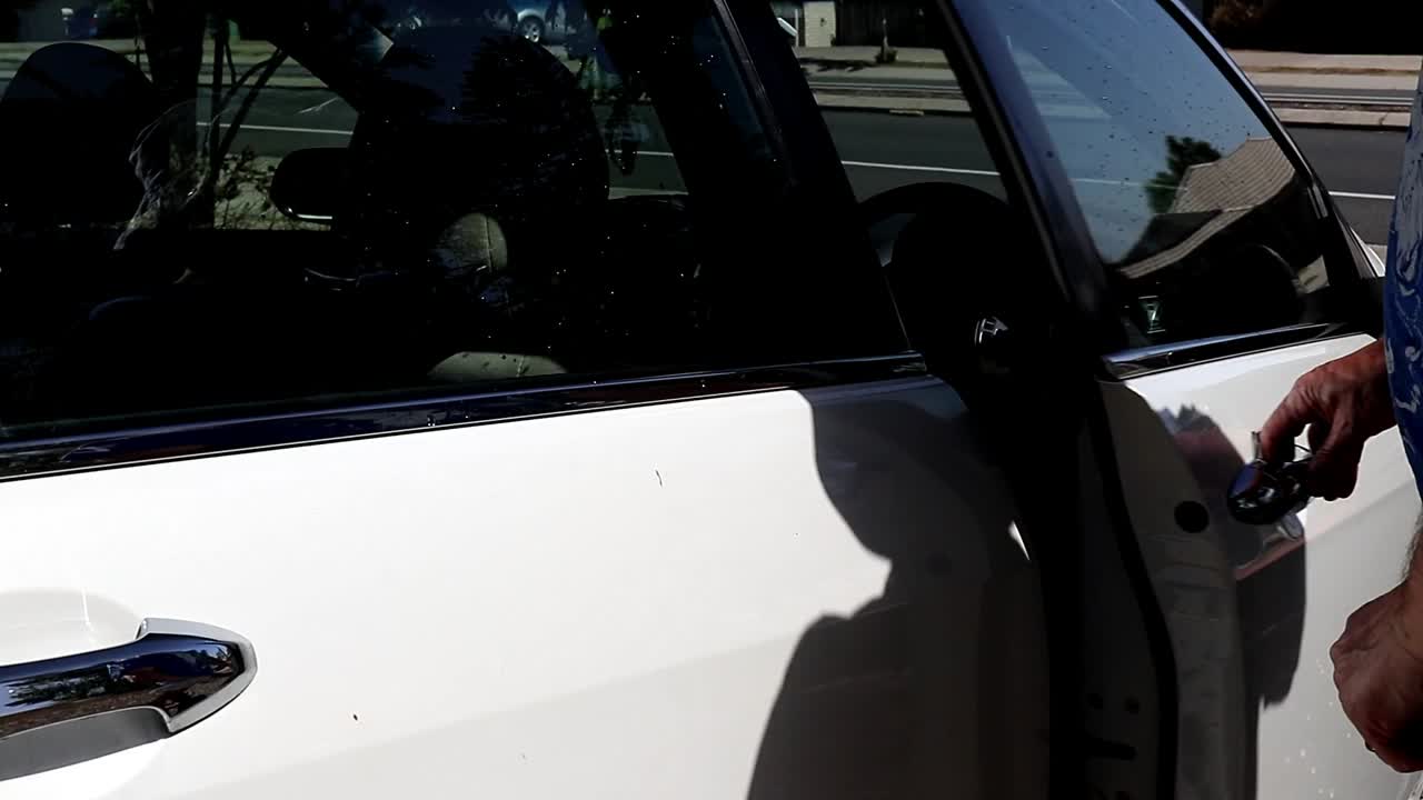 Man getting out of a car