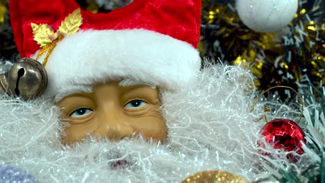 x-mas santa claus face in a red hat with bells, big white beard, christmas moving decoration, traditional holiday presents, new year decor, shiny colorful setup, creative close up shot, 4k video