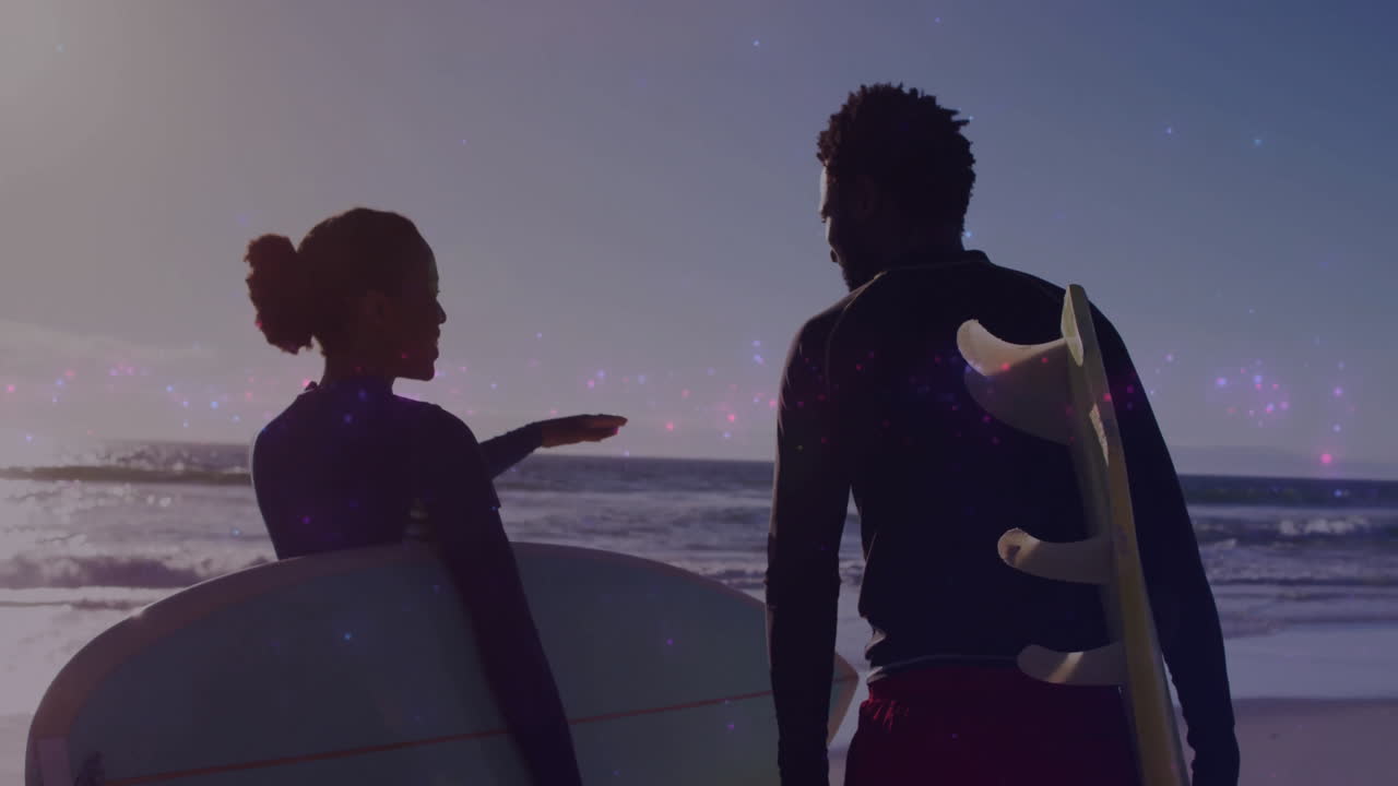 male and female surfers scanning ocean at sunset, overlaying animated wave height charts for tech