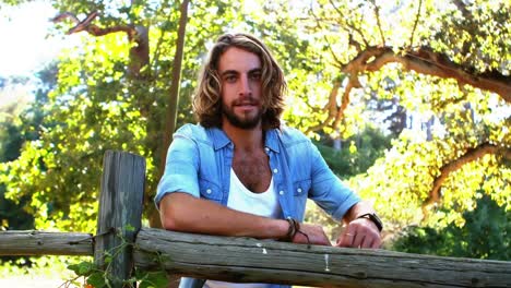 Portrait-of-man-standing-in-park