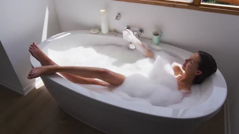 Woman-relaxing-in-a-bathtub