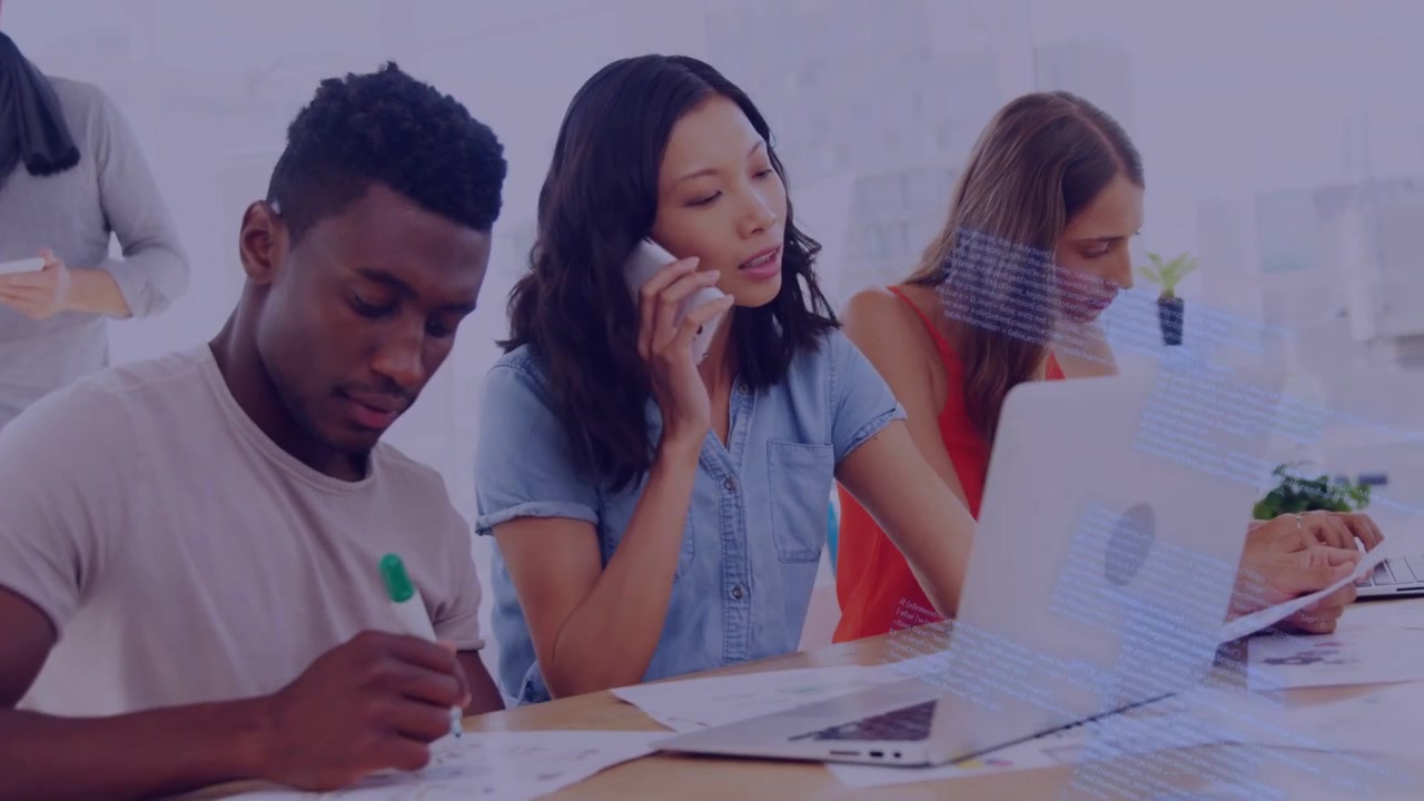 Team noting, tapping laptop and calling in tech office, blue code overlay causing call about code