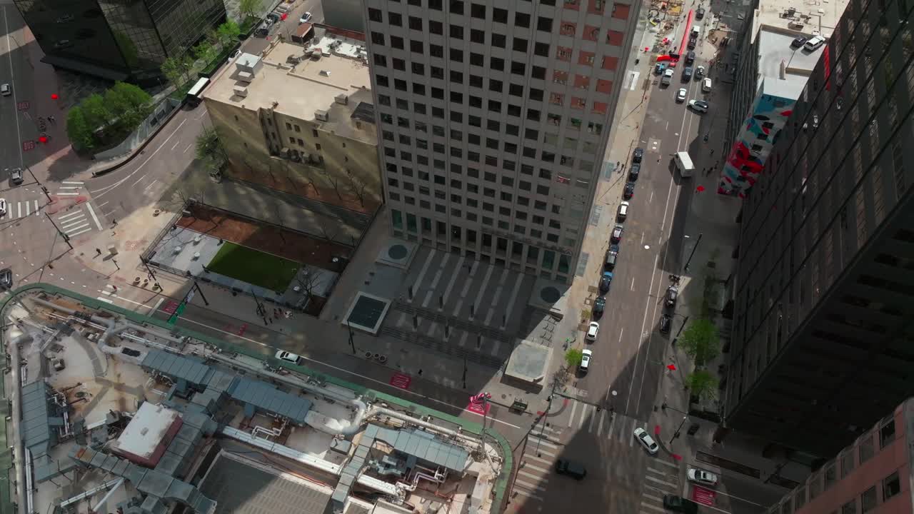 Downtown Denver cityscape tall skyscraper buildings Colorado aerial drone Birdseye view afternoon sunny shade streets car traffic business Republic Plaza City Park Rhino forward down motion