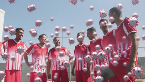 Animación-De-Células-Virales-Sobre-Diversos-Jugadores-De-Fútbol-Masculinos-Sonriendo.