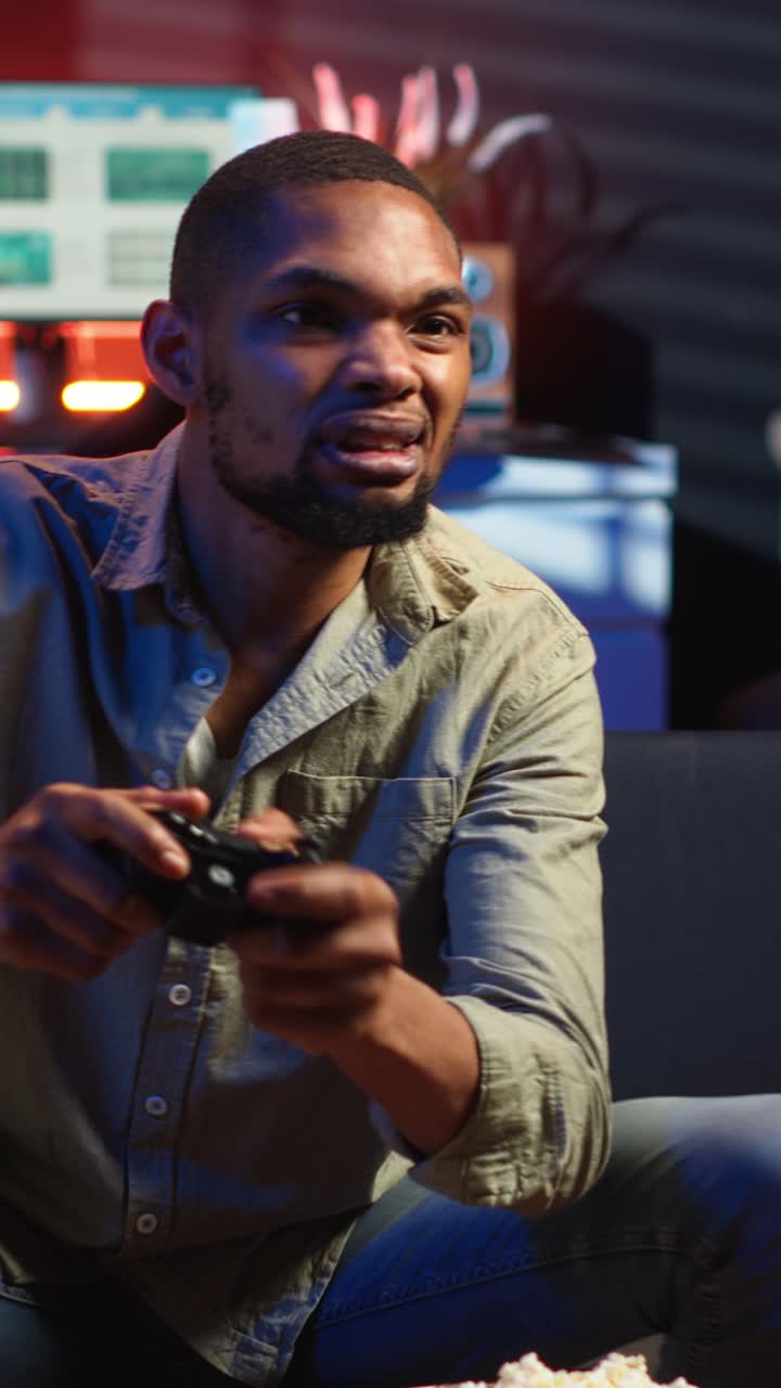 Vertical Video African american angry player being frustrated about his lost competition