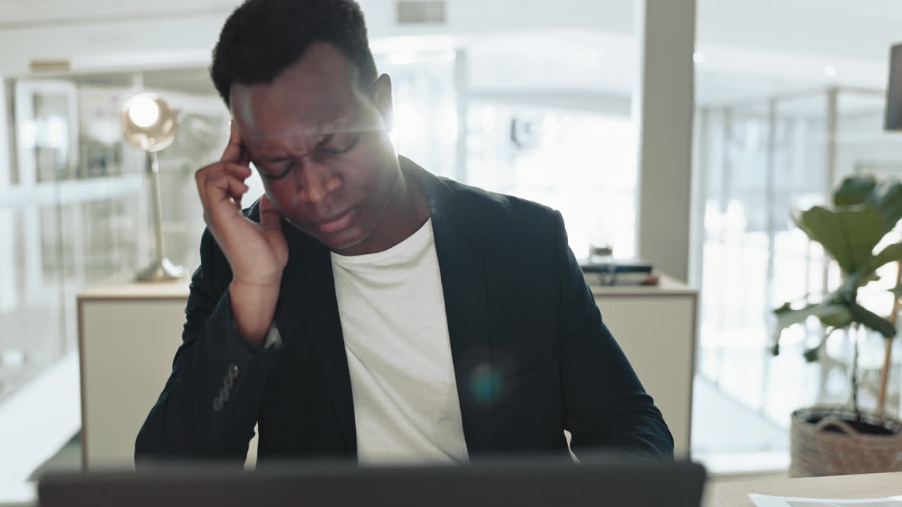 Black man, pain and headache in office