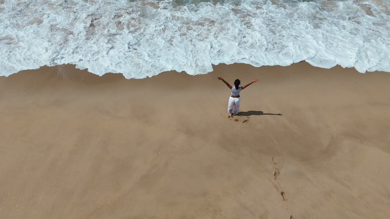 Woman on the Beach with Waves