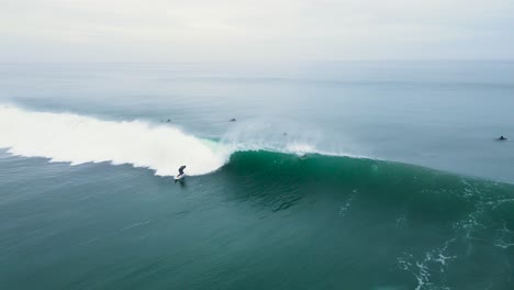 aerial view of unrecognizable surfers in the water in california