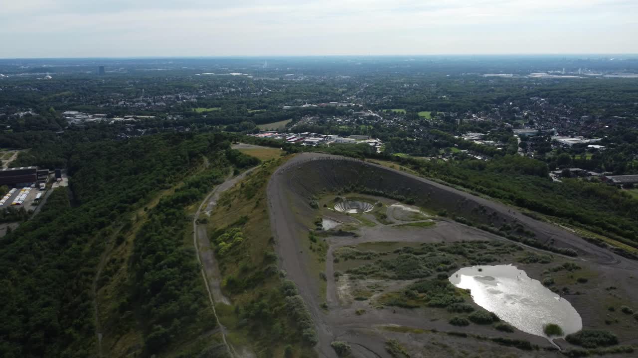 Aerial View of Slag Heap with City Panorama