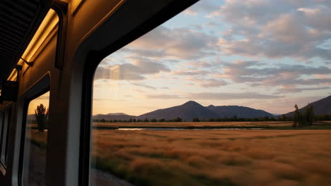 sunset mountain view from train window
