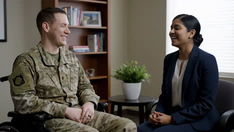 military veteran in wheelchair engages in conversation with professional woman