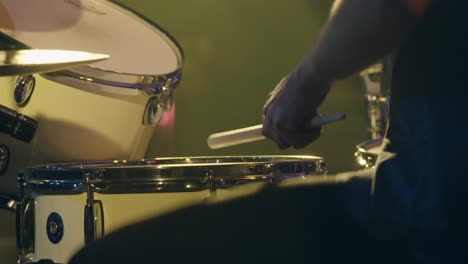 jazz drummer plays drums and cymbals at music festival