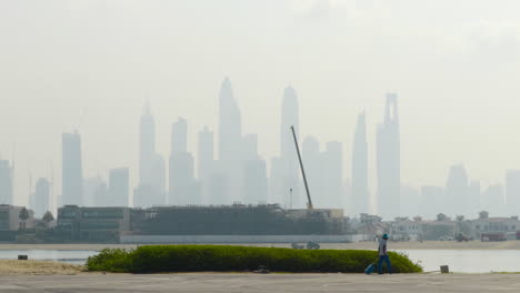 dubai skyline with construction and worker