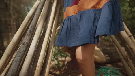 close-up-shot-of-the-brown-girl's-knees-and-legs-as-the-sunlight-hits-the-knees