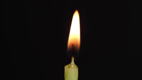 Close-up-birthday-candle-on-black-background,-Blowing-off-light