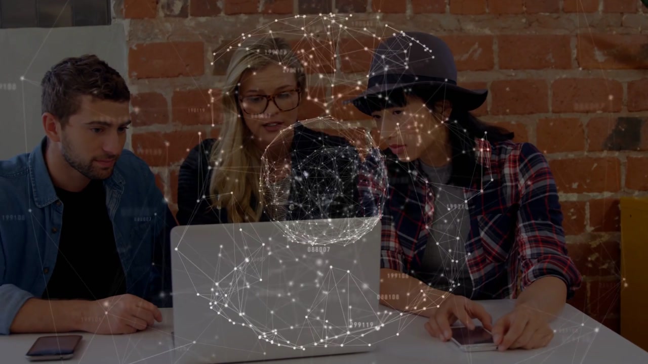 Team of three joining, hatted woman tapping laptop and phone, showing globe overlay for tech review