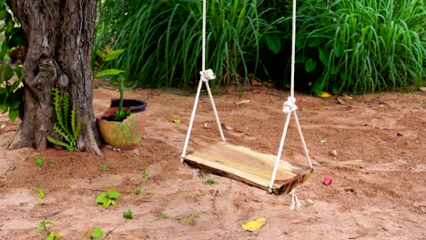 wooden swing in the garden