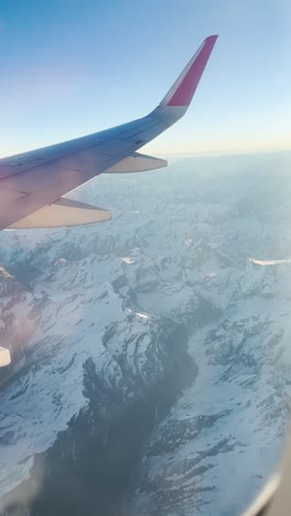 view from airplane window of himalayas