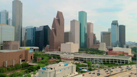 establishing parallax aerial shoot houston downtown in rush hour traffic on the interstate freeway 45