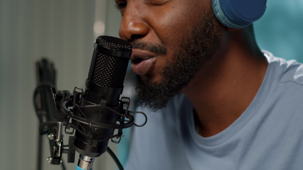 Close up of vlogger using microphone for online podcast