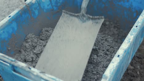 shovel mixed cement in bucket nice consistency slow motion