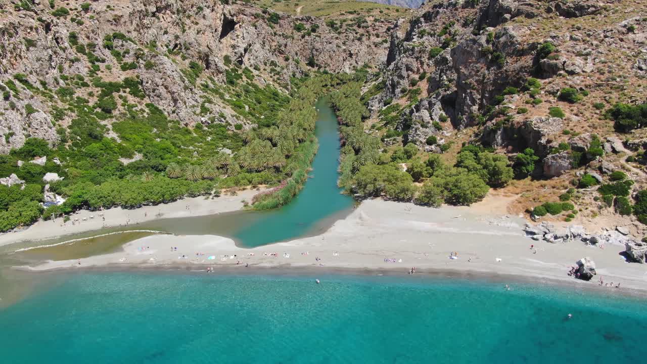 Panorama of Preveli beach at Libyan sea, river and palm forest