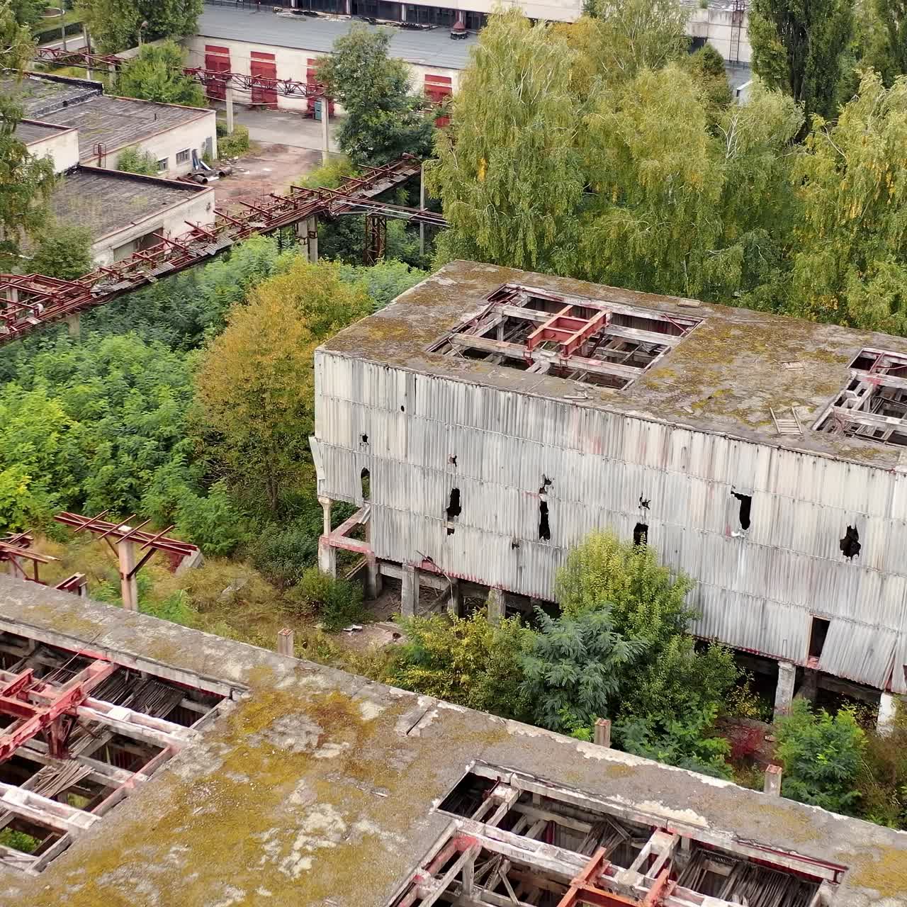Aerial view of destructive abandoned architecture. Factory destroyed empty buildings