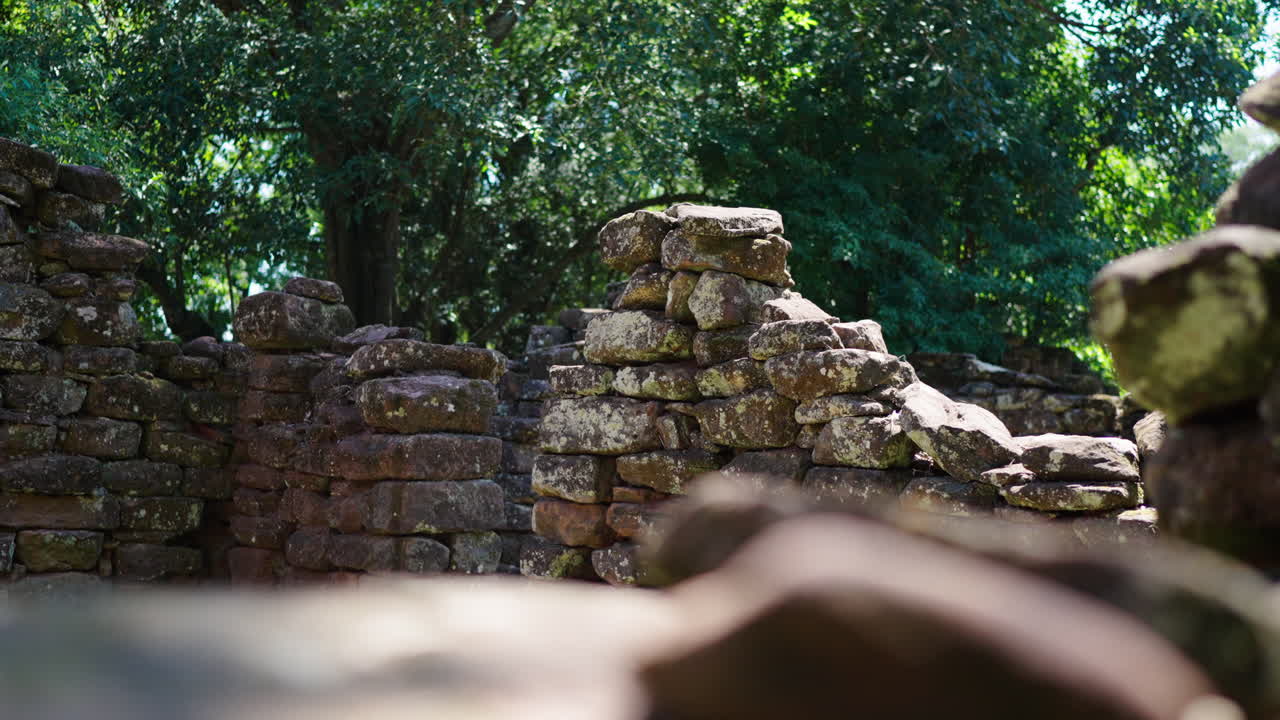 Bokeh shot of the old stone walls of San Gnacio, ruins in Argentina on a sunny day, tourism, touristic in the green nature
