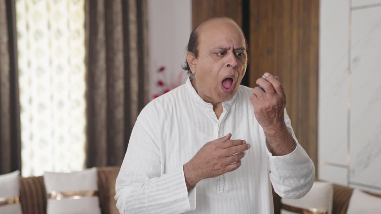 Old Indian man having Asthma attack