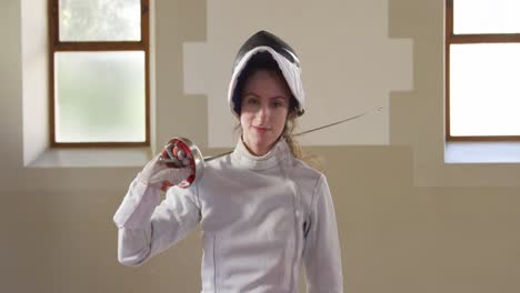 Female-fencer-athlete-during-a-fencing-training-in-a-gym