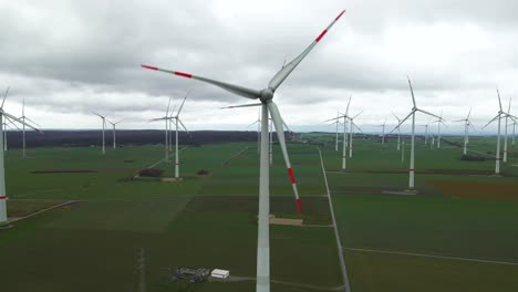 sustaining the future of power generation: high angle view of wind turbines producing clean energy on a cloudy day