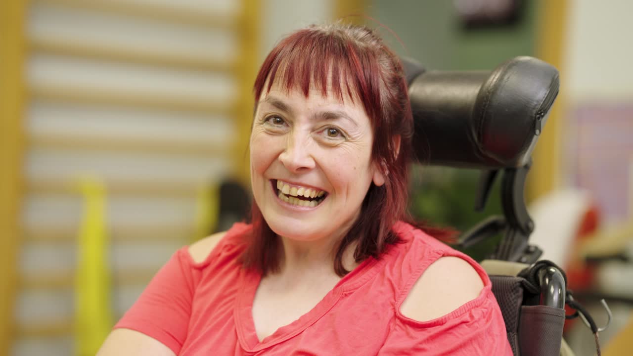 Woman in wheelchair smiling