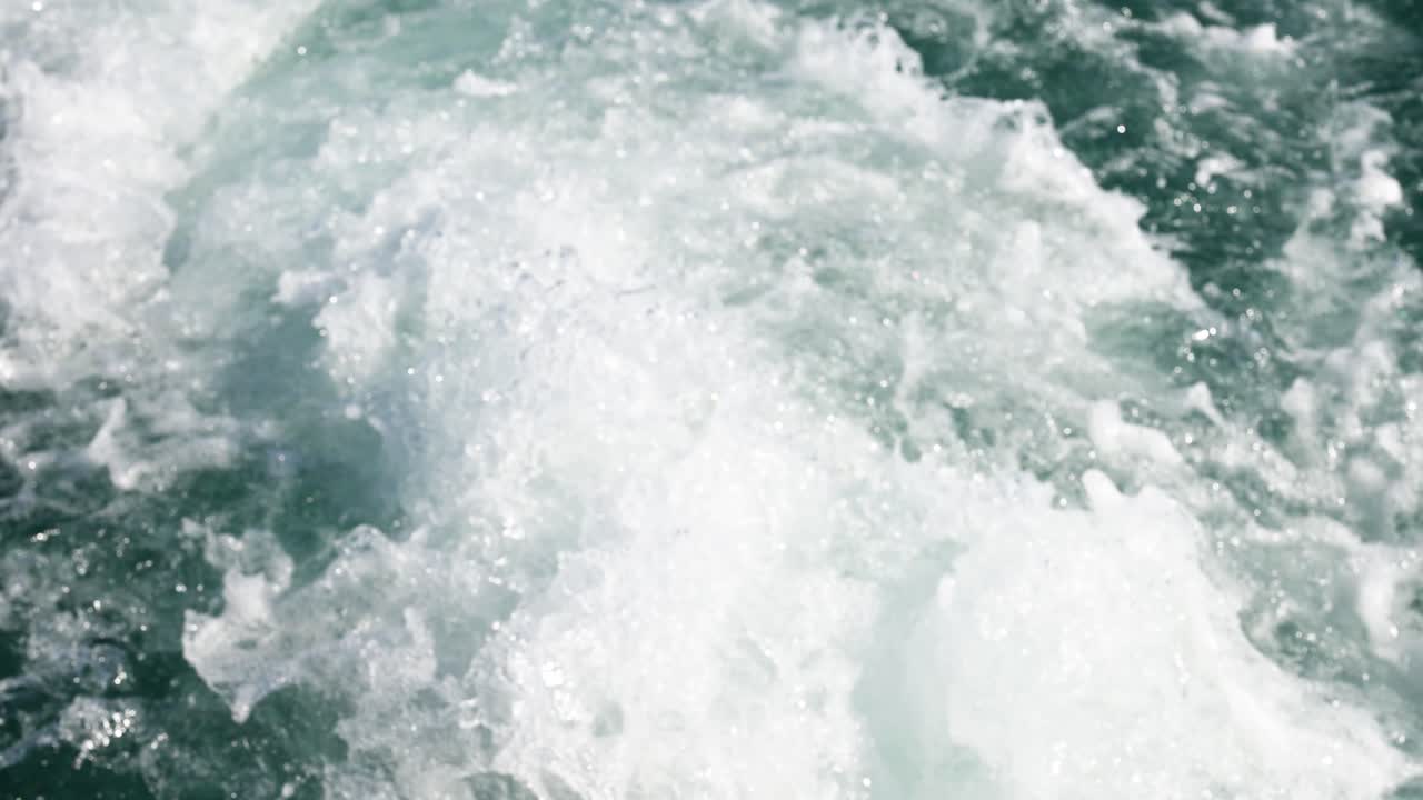 A sequence of ocean waves crashing, showcasing dynamic movement and natural energy in bright daylight