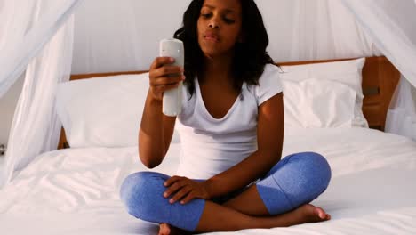 teenage girl using remote control
