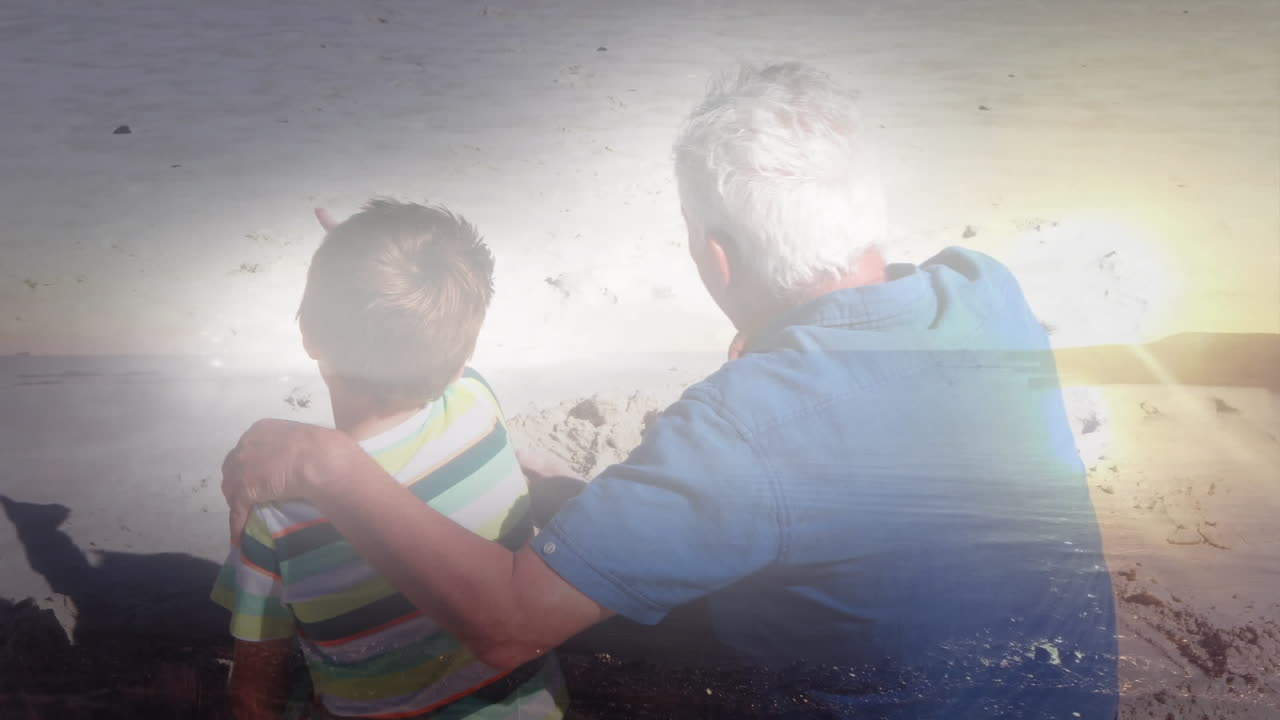 해변에서 손자와 함께 노인 위에 반 ⁇ 이는 빛의 애니메이션