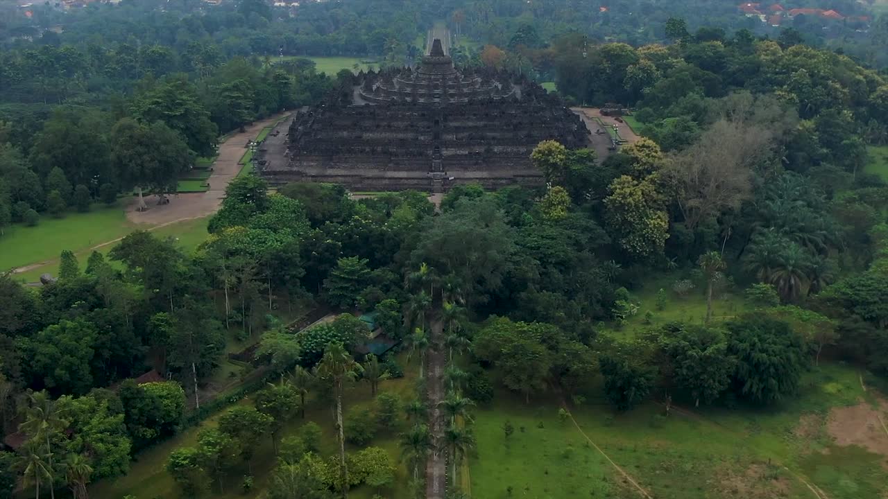 Grand monument of Buddhist Borobudur Temple in Java, Indonesia aerial ...