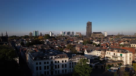 lepelenburg park with the cityscape of utrecht in the background where the scaffolded church tower rises above the urban dutch city