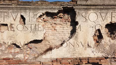 the inscription originally placed on the main gate of ostia antica, a world famous archeological site from ancient rome