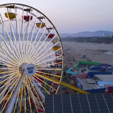 Aerial-Of-The-Santa-Monica-Pier-And-Ferris-Wheel-At-Night-Or-Dusk-Light-Los-Angeles-California