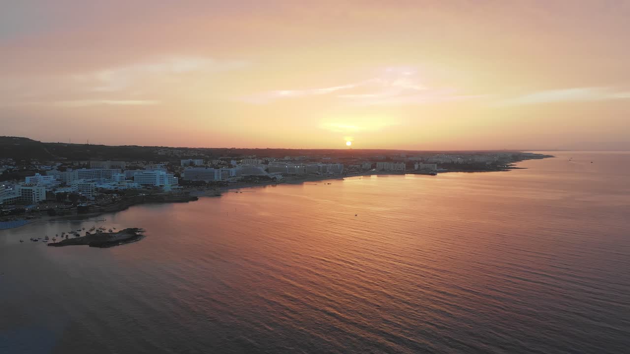 Aerial drone shot of a Beautiful sunset above Protaras city, Cyprus