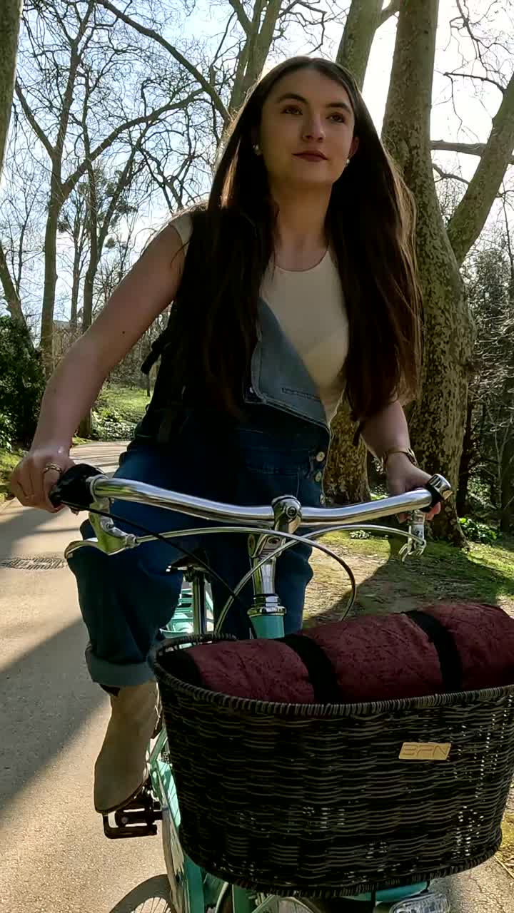 Woman riding bicycle in park