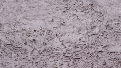 Closeup-of-hot-mud-pool-bubbling-in-volcanic-geothermic-area-of-New-Zealand