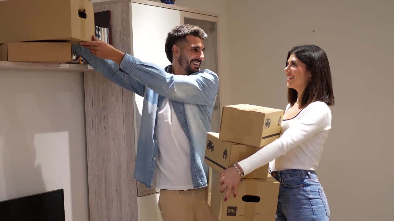 Couple Moving into New Home with Cardboard Boxes