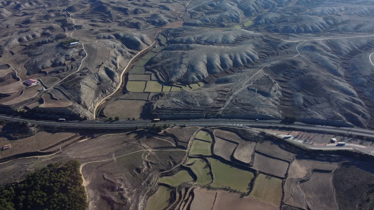 Aerial View of Terraced Hills and Highway