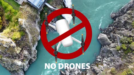 aerial view of a drone flying over a turquoise river in a rocky canyon, followed by a no-drone warning symbol
